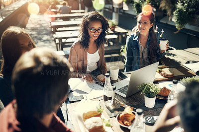 Buy stock photo High angle shot of a group of creative employees having a breakfast meeting outside