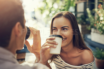 Buy stock photo Cropped shot of two creative employees toasting with coffee cups outside