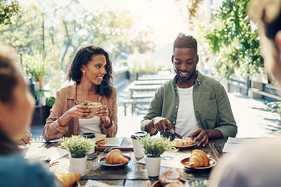 Buy stock photo Cropped shot of a group of creative employees having a breakfast meeting outside