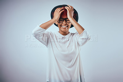 Buy stock photo Happy, woman and laughing from funny joke with hipster fashion and glasses in studio. Smile, trendy and silly mistake from epic fail with model eyewear and minimalist style in grey background