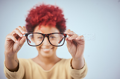 Buy stock photo Studio shot of a a woman showing off her spectacles