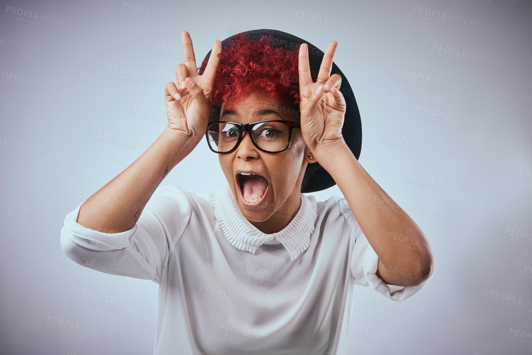 Buy stock photo Peace sign, surprise and portrait of woman in studio with smile for emotion, excited and emoji reaction. Redhead, glasses and isolated person with confidence, silly and positivity on white background