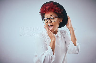 Buy stock photo African woman, silly and surprise portrait with fashion and hipster style with wow and happy smile. Studio, glasses and trendy eyewear with minimalist outfit and hip clothes with grey background