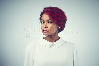 Buy stock photo Studio shot of a beautiful young woman against a gray background