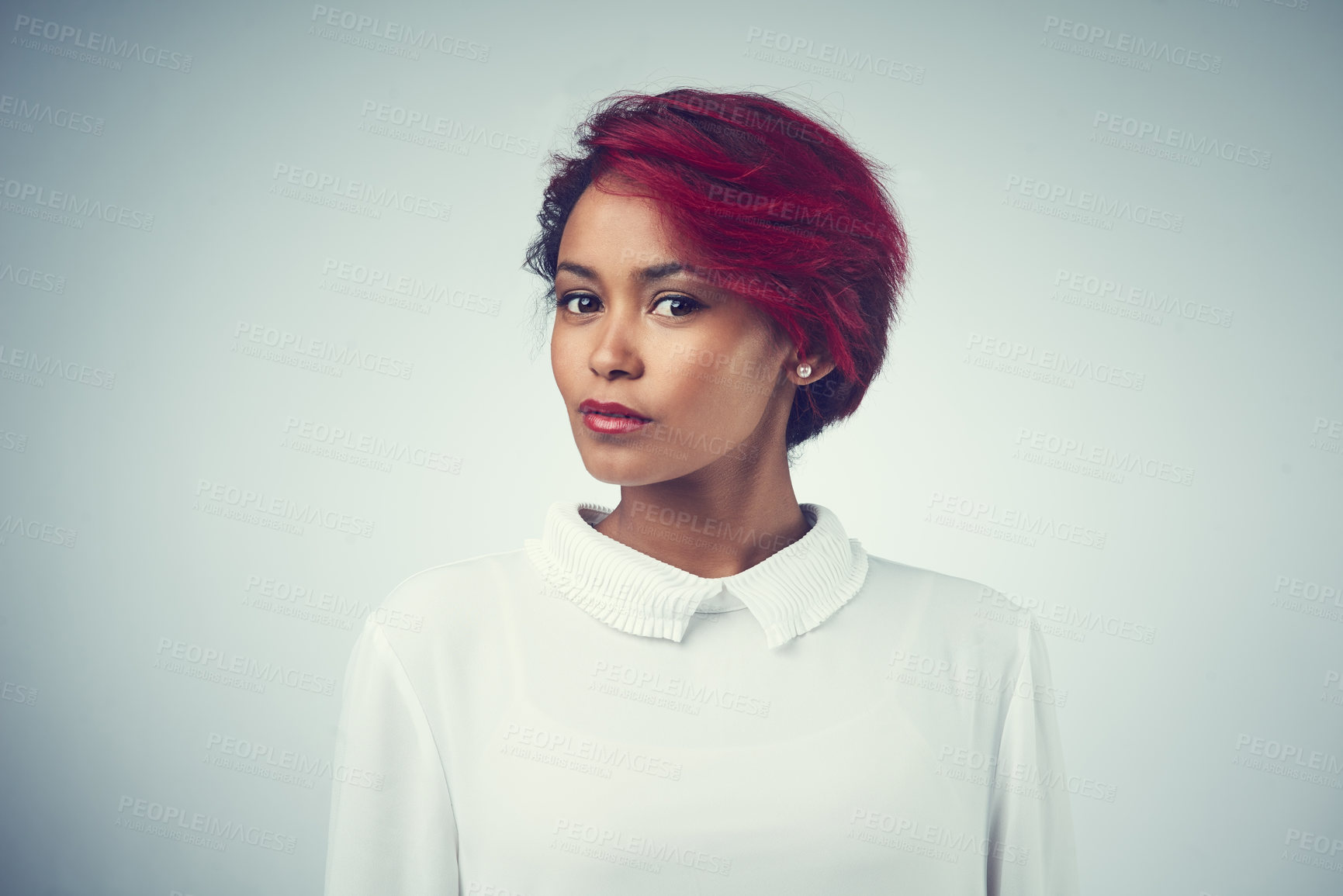 Buy stock photo African woman, face and hair care in studio for confidence, texture and cosmetics with red dye. Female person, portrait and treatment on gray background for hairdresser, salon and transformation