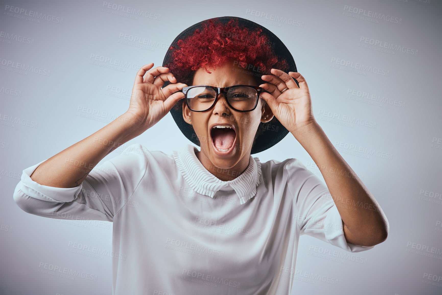 Buy stock photo African woman, shout and portrait with fashion and hipster style with yelling and angry emoji gesture. Studio, glasses and trendy eyewear with minimalist outfit and hip clothes with grey background