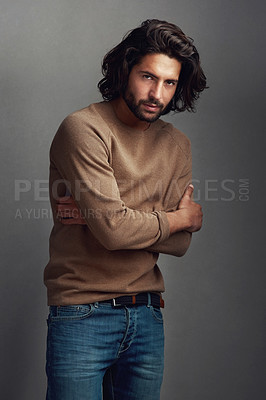 Buy stock photo Fashion, portrait and man in studio with confidence for trendy clothes, winter sweater or arms crossed on gray background. Outfit, wardrobe and male model for stylish, designer jersey or denim jeans