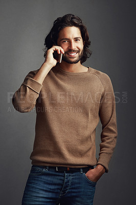 Buy stock photo Man, portrait smile and phone call for conversation with contact, communication and speaking in studio. Male person, happy and mobile for fun chat, gossip storytelling and network by gray background