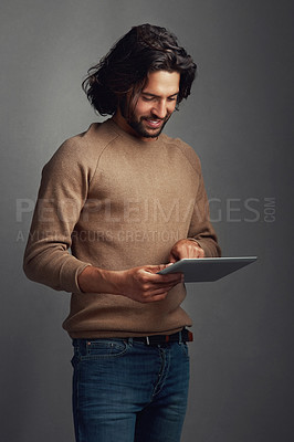 Buy stock photo Tablet, research and business man in studio online for social media, network or email notification. Digital technology, smile and creative copywriter scroll on website isolated on gray background