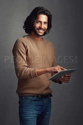 Buy stock photo Tablet, portrait and business man in studio on app for social media, network or email notification. Digital technology, smile or creative fashion blogger scroll on website isolated on gray background