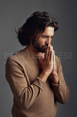 Buy stock photo Faith, praying or thinking with spiritual man in studio on dark background for belief in God or Jesus. Praise, vision or worship with Christian man in prayer for blessing, confession or gratitude