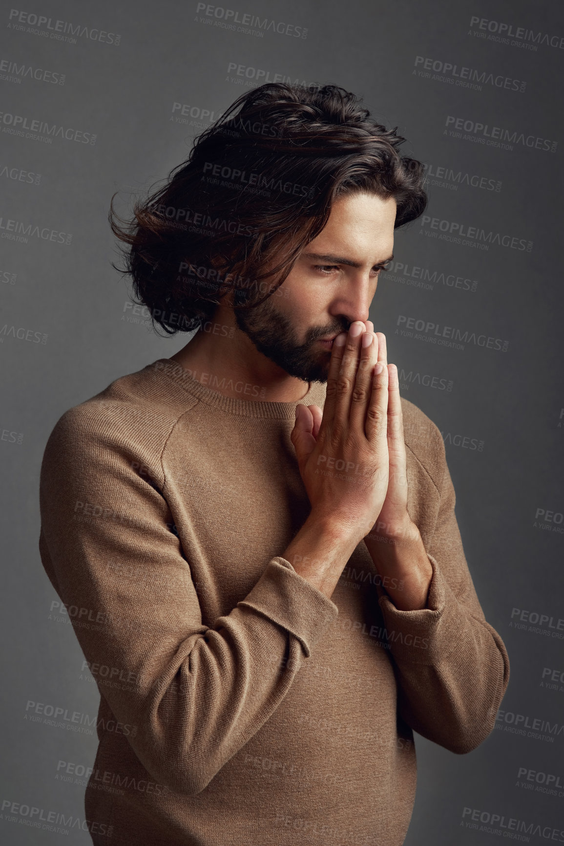 Buy stock photo Faith, praying or thinking with spiritual man in studio on dark background for belief in God or Jesus. Praise, vision or worship with Christian man in prayer for blessing, confession or gratitude