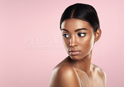 Buy stock photo Face, skincare and Indian woman with makeup in studio               with marketing mockup space and pink background. Facial, wellness and beautiful young glowing model with healthy beauty products