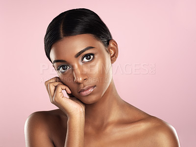Buy stock photo Face portrait, skincare and serious woman in studio isolated on a pink background. Natural beauty, aesthetic and Indian female model with makeup, cosmetics or spa facial treatment for healthy skin.
