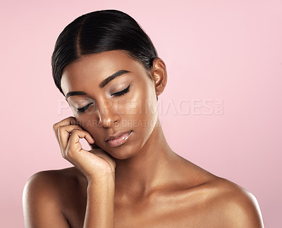 Buy stock photo Beauty, face and skincare with natural Indian woman in studio isolated on pink background for self care. Aesthetic, eyes closed and wellness with perfect young model at salon or spa for cosmetics