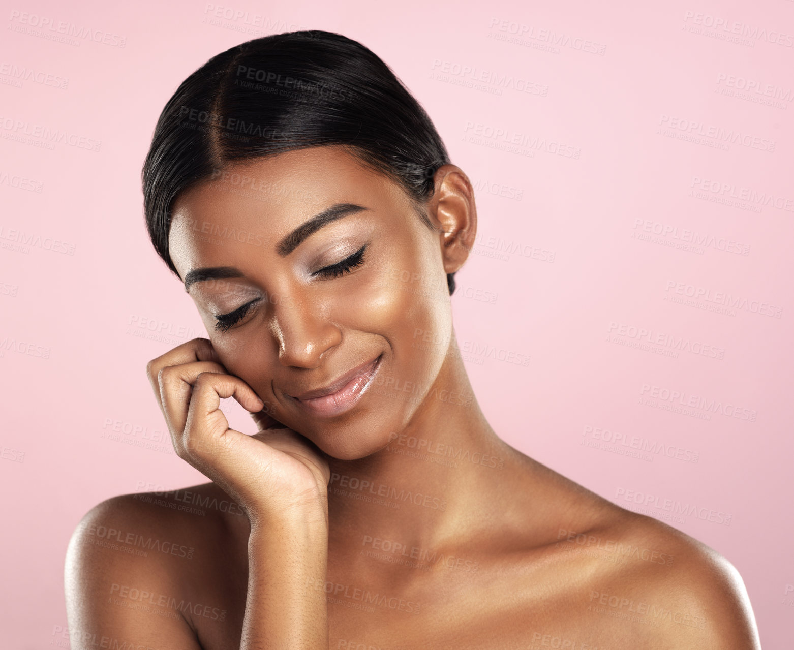 Buy stock photo Beauty, face and smile with natural Indian woman in studio isolated on pink background for cosmetics. Aesthetic, eyes closed and skincare with perfect young model at salon or spa for cosmetics