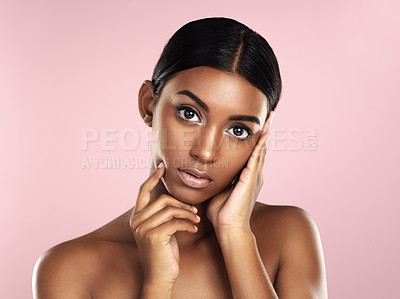 Buy stock photo Serious face, skincare and woman in studio isolated on a pink background. Natural beauty, portrait and Indian female model with makeup, cosmetics and spa facial treatment for healthy skin aesthetic.