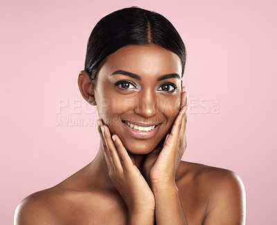 Buy stock photo Studio portrait of a beautiful young woman posing against a pink background