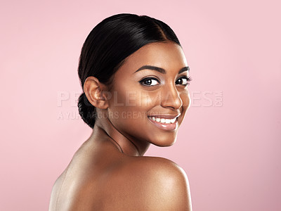 Buy stock photo Face, skincare and smile of woman in studio isolated on a pink background mockup space. Natural beauty, portrait and Indian female model with makeup, cosmetics or spa facial treatment for skin health