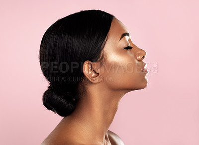 Buy stock photo Studio shot of a beautiful young woman posing with her eyes closed against a pink background