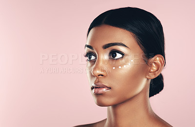 Buy stock photo Thinking, skincare and beauty of woman with cream in studio isolated on pink background mockup space. Dermatology, creme cosmetics and Indian female model with moisturizer lotion for healthy skin.