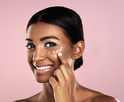 Buy stock photo Smile, skincare and face of woman with cream in studio isolated on a pink background. Dermatology, creme cosmetics and portrait of happy Indian female model apply moisturizer lotion for healthy skin.