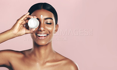 Buy stock photo Happy, skincare and woman with cream container in studio isolated on pink background mockup space. Eyes closed, creme cosmetics and Indian female model with lotion, moisturizer product or dermatology