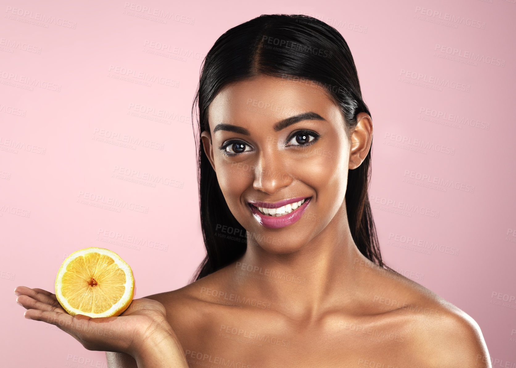 Buy stock photo Face, skincare and smile of woman with an orange in studio isolated on pink background. Fruit, natural cosmetics and portrait of Indian female model with food for healthy diet, vitamin c or nutrition