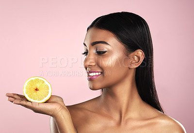 Buy stock photo Skincare, face and smile of woman with an orange in studio isolated on pink background. Fruit, natural cosmetics and Indian female model holding food for healthy diet, nutrition or vitamin c to detox