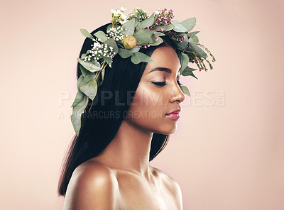 Buy stock photo Studio shot of a beautiful young woman wearing a wreath while posing with her eyes closed against a pink background