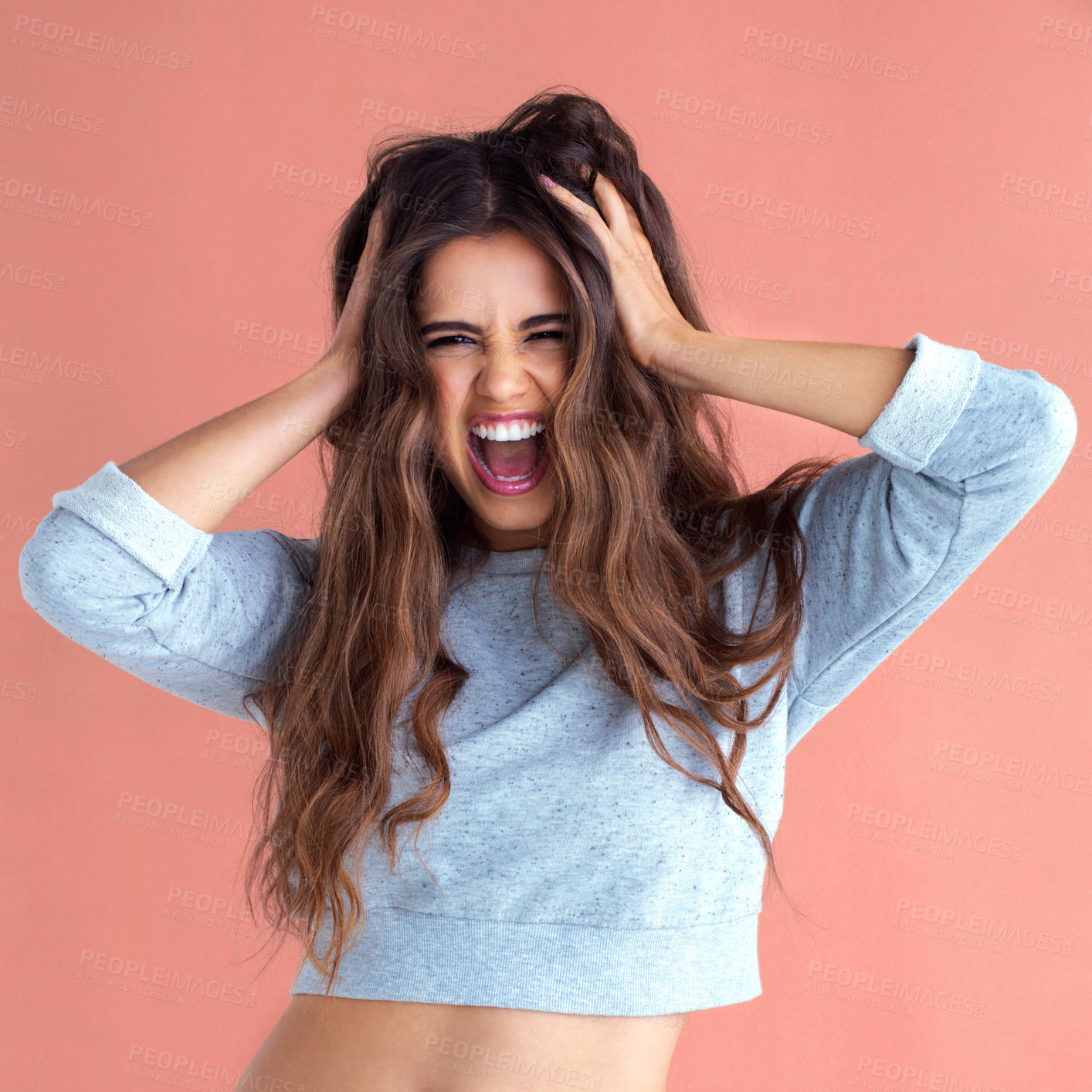 Buy stock photo Studio shot of a beautiful young woman posing against a pink background