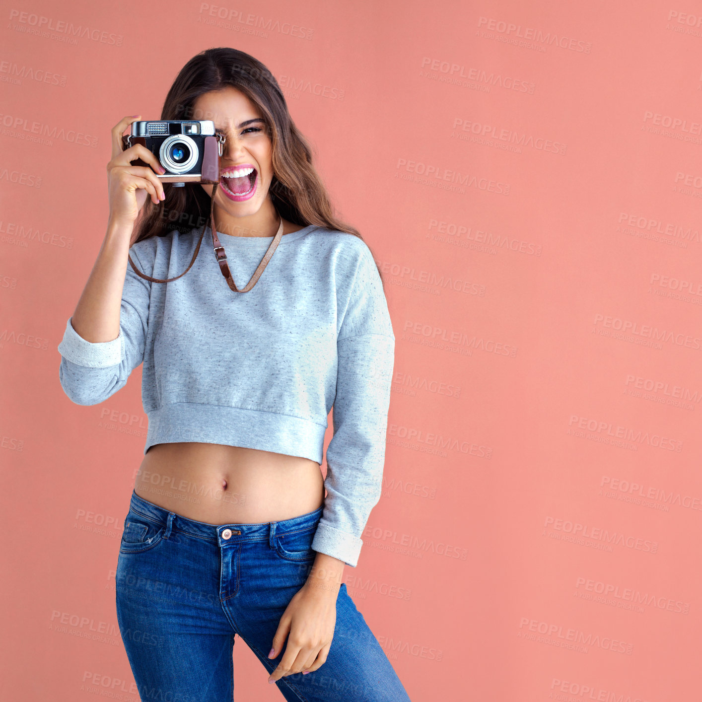 Buy stock photo Happy, excited woman and camera with retro and photography in studio with smile. Gen z, vintage and laugh with photo and creative college student with photographer and funny with colorful background