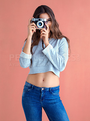 Buy stock photo Happy, woman and camera with retro, lens and photography in studio with smile. Gen z, vintage and excited with photo and creative college student with photographer with colorful background and fun