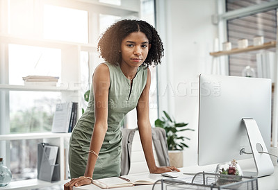 Buy stock photo Computer, portrait and serious business woman working by her desk or table in a corporate startup company. Internet, online and young professional female employee or planner in an agency office