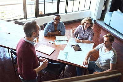 Buy stock photo Shot of a creative business team having a meeting and discussing business related issues in the office