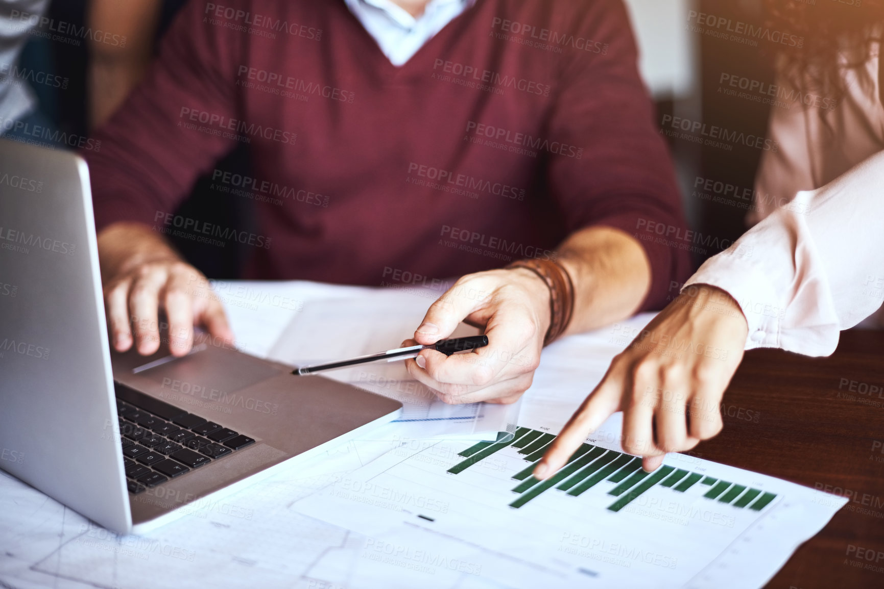Buy stock photo Shot of unrecognizable businesspeople looking at business charts