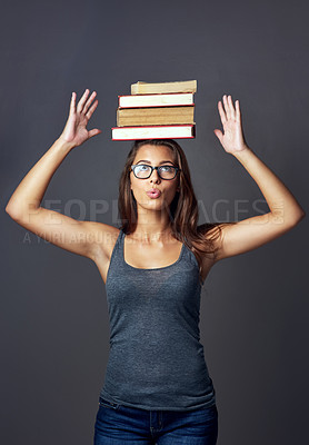 Buy stock photo Student, head and balance books for education, learning or studying isolated on gray studio background. Woman, university and textbook stack for knowledge, info or thinking of research scholarship