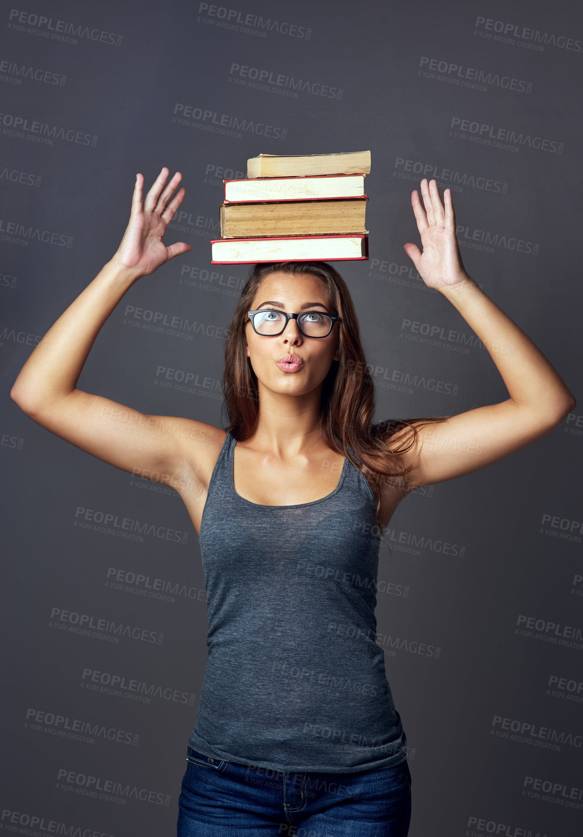 Buy stock photo Student, head and balance books for education, learning or studying isolated on gray studio background. Woman, university and textbook stack for knowledge, info or thinking of research scholarship