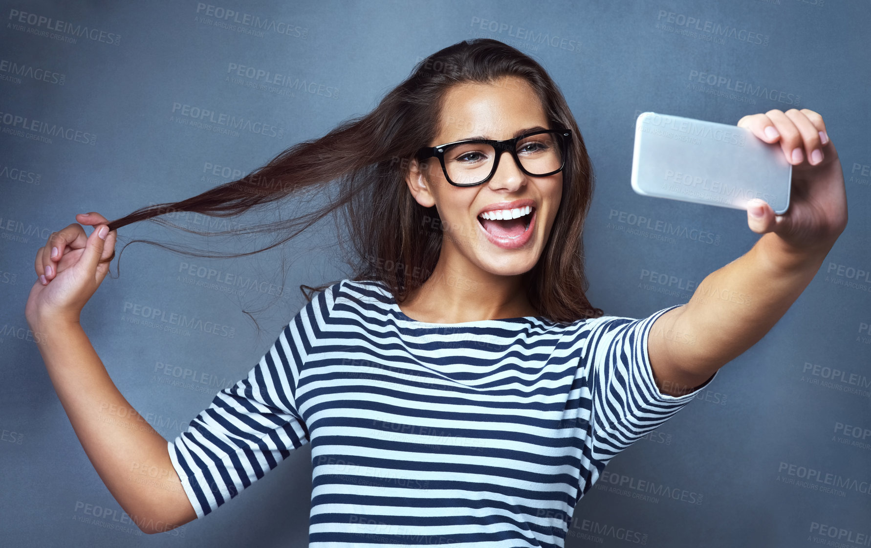 Buy stock photo Female person, glasses and selfie with smile, optometry and confidence on gray studio background. Woman, memory and happy for eyewear, social media and eye care with post, clear vision and frame lens