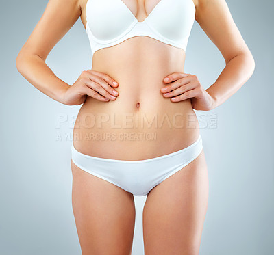 Buy stock photo Body, stomach and underwear with model in studio on gray background for health or wellness. Abdomen, diet and transformation with figure of women in bra and panties for cosmetics or losing weight