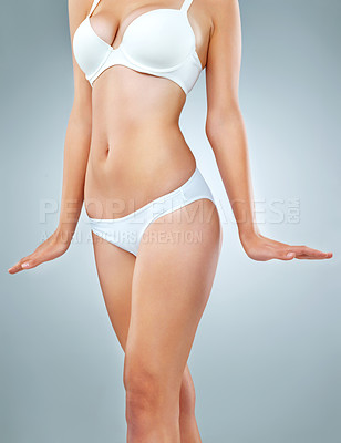 Buy stock photo Health, body and underwear with woman in studio on gray background for beauty or wellness. Abdomen, natural or bodycare with figure of perfect model in bra and panties for diet or losing weight