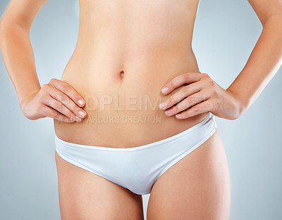 Buy stock photo Body, stomach and underwear with natural woman in studio on gray background for health or wellness. Beauty, skin or transformation with figure of model in panties for detox, diet or losing weight