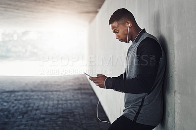 Buy stock photo African man, phone and earphones with text, start and workout for training and health. Athlete, music and cellphone for cardio, sports and wellness with exercise and outdoor summer fitness for runner