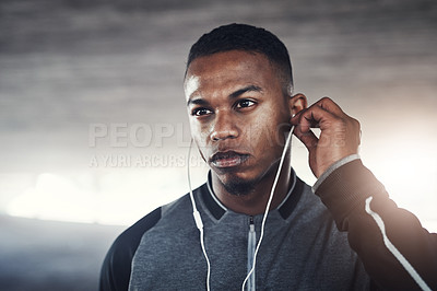 Buy stock photo Fitness, earphones and man with thinking for workout, exercise planning or cardio for wellness. Male person, idea and serious with headphones for audio, music streaming or training podcast in morning