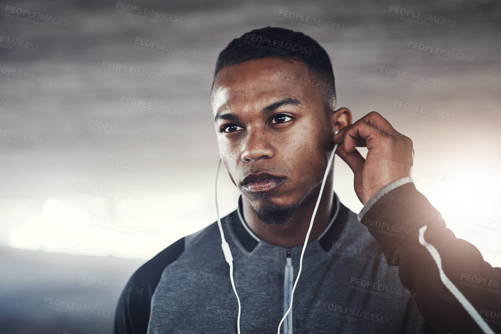 Buy stock photo Fitness, earphones and man with thinking for workout, exercise planning or cardio for wellness. Male person, idea and serious with headphones for audio, music streaming or training podcast in morning