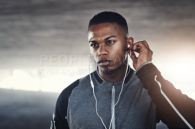 Buy stock photo Fitness, earphones and man with thinking for training, workout planning and wellness music. Serious, male person and idea with headphones for podcast, audio streaming and cardio exercise in morning