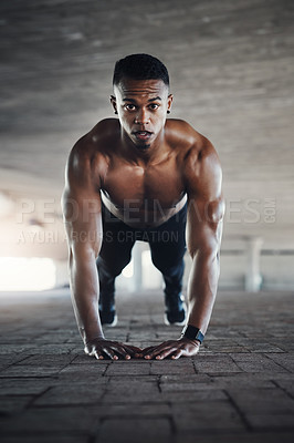 Buy stock photo Full length portrait of a handsome young man doing pushups while exercising outside