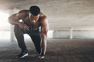 Buy stock photo Black man, athlete and outdoor or start exercise with muscle in parking garage for cardio, fitness or strength. Male person, ground and shirtless for summer run is sportswear, wellness or training