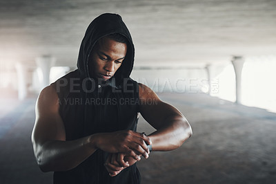 Buy stock photo Black man, athlete and smartwatch for running monitor in parking garage for heart rate, calories or cardio. Male person, wrist and checking for fitness training or healthy progress, tracking or goals
