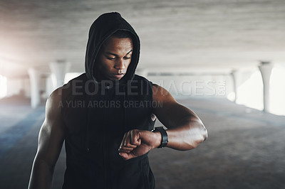 Buy stock photo Black man, athlete and smart watch for exercise monitor in parking garage for heart rate, calories or cardio. Male person, wrist and checking for fitness training or healthy progress, app or goals